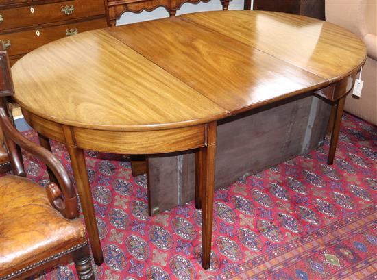 A George III mahogany D-end extending dining table, L.160cm extended, two spare leaves, no clips